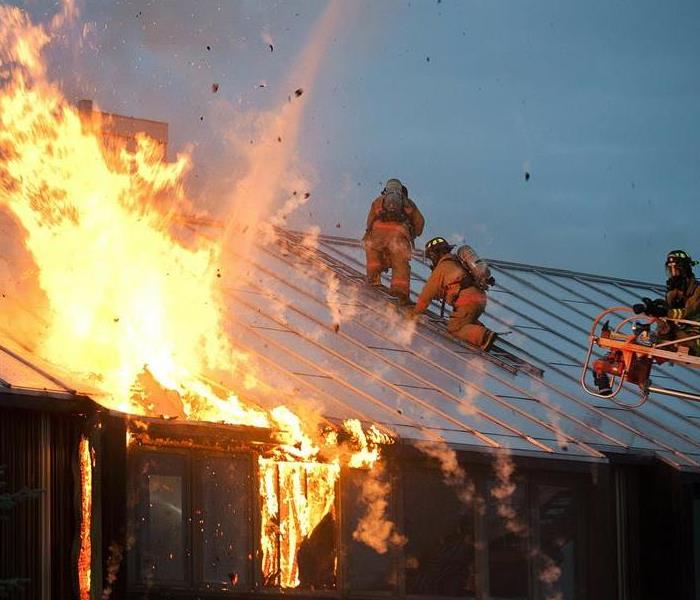 Firefighters on a commercial roof.